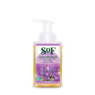 A clear bottle of Lavender Fields Hydrating Foaming Hand Wash with organic agave and aloe vera, a white pump, and a label with lavender flowers and green leaves on a purple background.