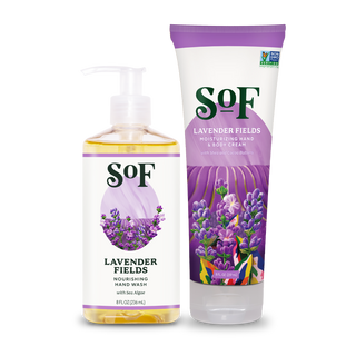 A bottle of Lavender Fields Liquid Hand Wash and a tube of Hand & Body Cream, both featuring lavender flower illustrations on purple and white packaging.