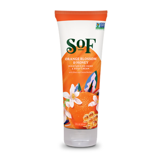 An 8 oz (227 g) tube of Orange Blossom & Honey Hand and Body Cream, enriched with shea and cocoa butter, features orange, white blossom, and honeycomb illustrations, delivering rich hydration for your skin.
